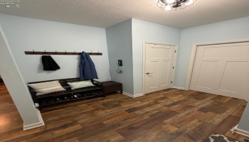 The Mudroom is complete with a bench, 2 closets and easy access to the Laundry Room and 2-car garage.