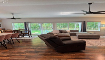 Look at that view!  A wall of windows and TWO patio doors! TWO fans! Vaulted ceiling!