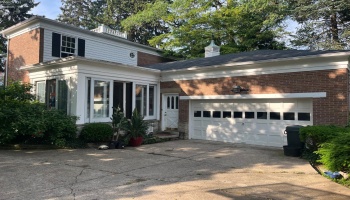 Rear of the home with 2 car garage.