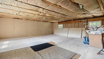 625 square feet of unfinished storage area above 3-car garage on west end