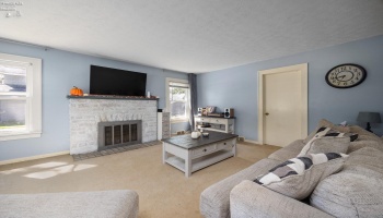 Living room with wood burning fireplace