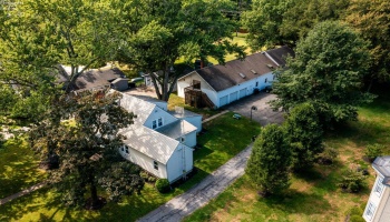 Nice ariel showing the house and the garage with apartment
